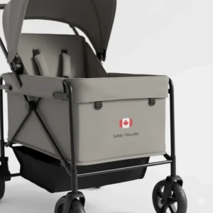 A minimalist graphic of a stroller wagon featuring a small Canadian flag icon and bilingual "Safety / Sécurité" labels.
