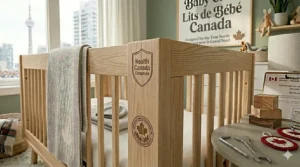 Alt text for image 5: An engraved circular seal on a wooden crib post certifying the use of sustainably harvested Canadian oak.
