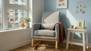 A cozy woodland themed Canadian nursery featuring a compact rocking nursery chair for small spaces with a warm plaid throw.