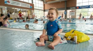Baby wearing a reusable swim diaper ready for daycare swimming lessons at a Canadian community pool