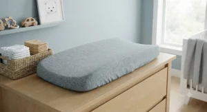 Breathable bamboo changing pad cover in grey designed for baby boys.